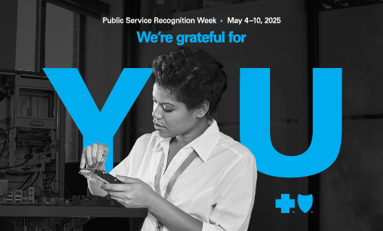 One female IT employee observing a piece of hardware. Text overlay reads "We're thankful for you" with Blue Cross Blue Shield branding, highlighting Public Service Recognition Week, May 4-10, 2025.