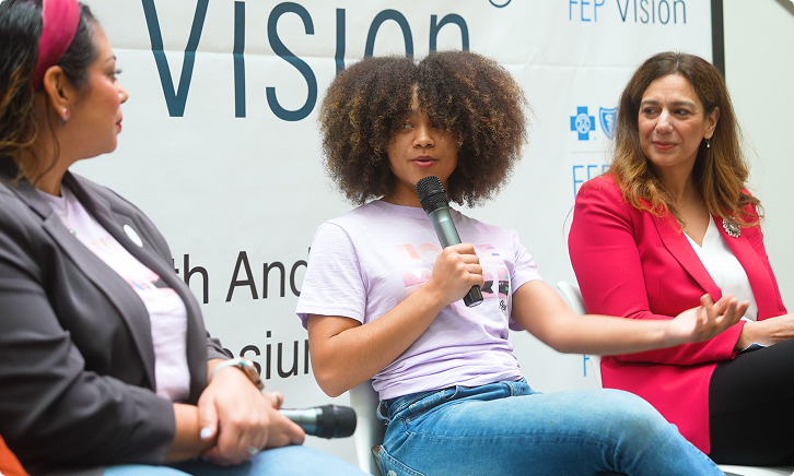 Women speaking on a panel